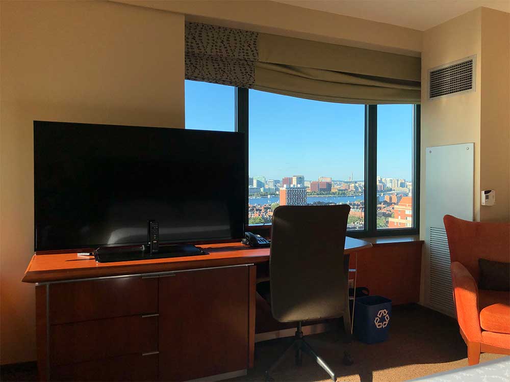 TV and desk across from bed.